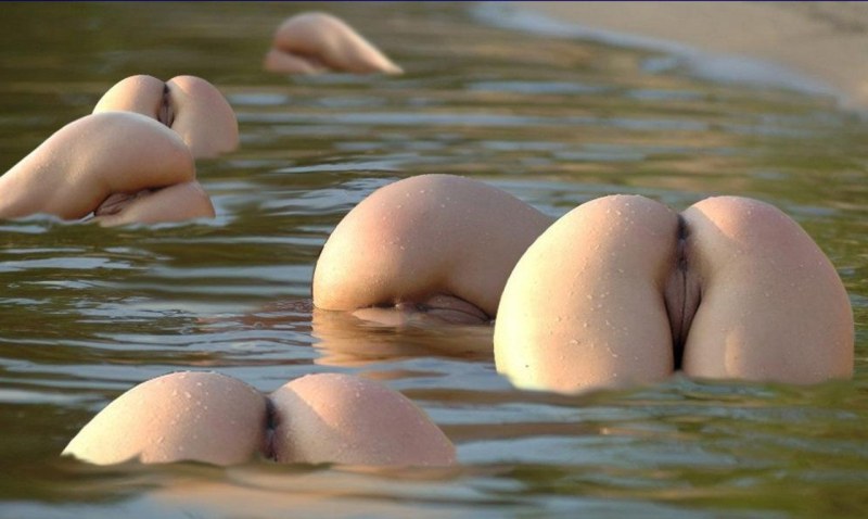 Naked female priests in water