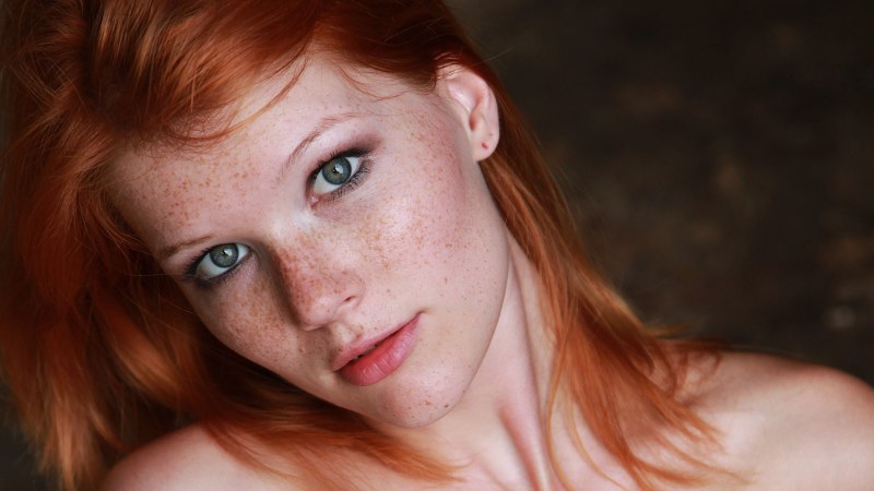 Girl with freckles sucks