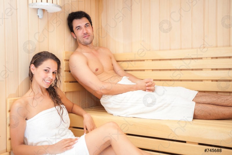 Photoshoot of a couple in a sauna