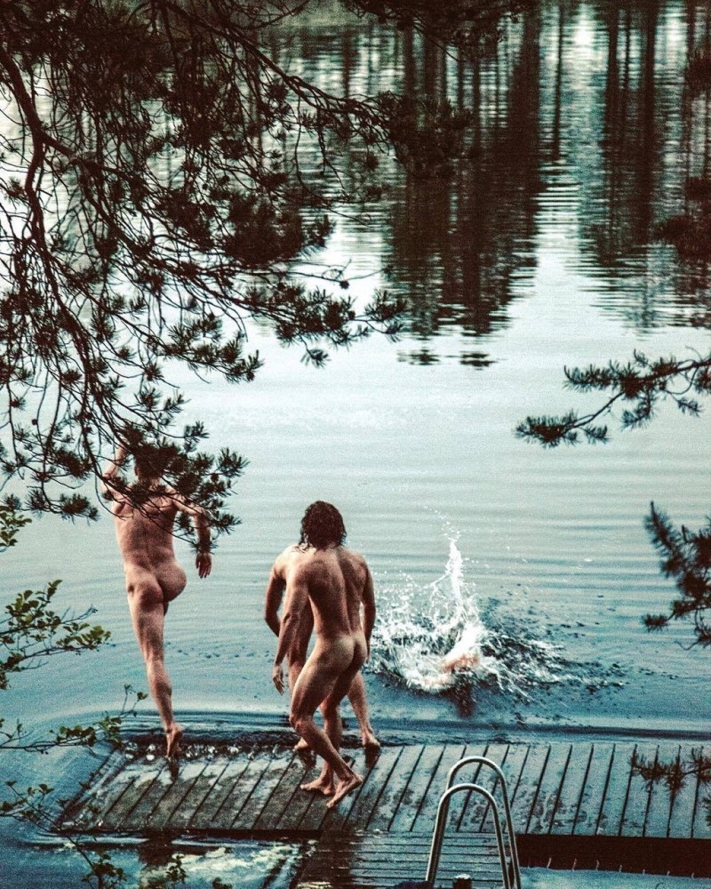 Naked women in a forest pond