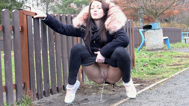 Pissing on the street in a skirt