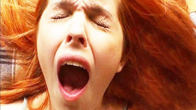 The face of a moaning woman