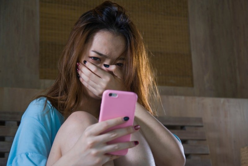 Girl crying with a mobile phone