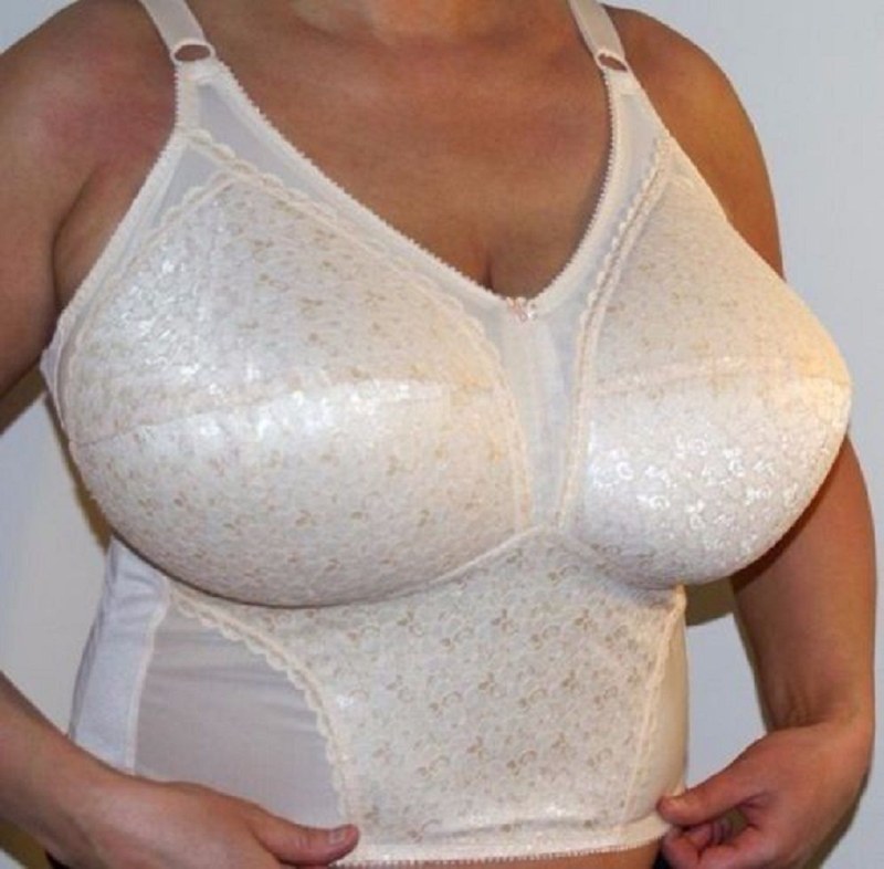 Elderly women with big breasts in a bra