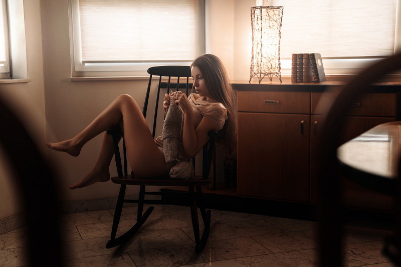 The girl poses in the room