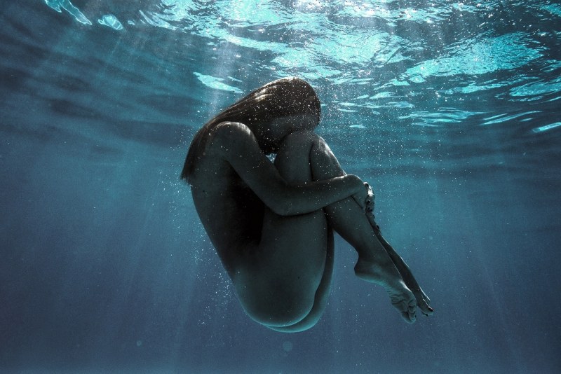 Naked women give birth in water