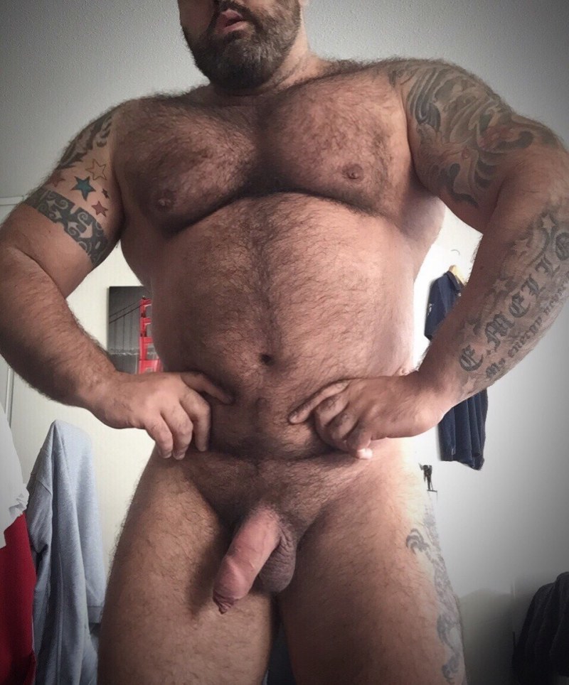 A naked hairy man sleeps