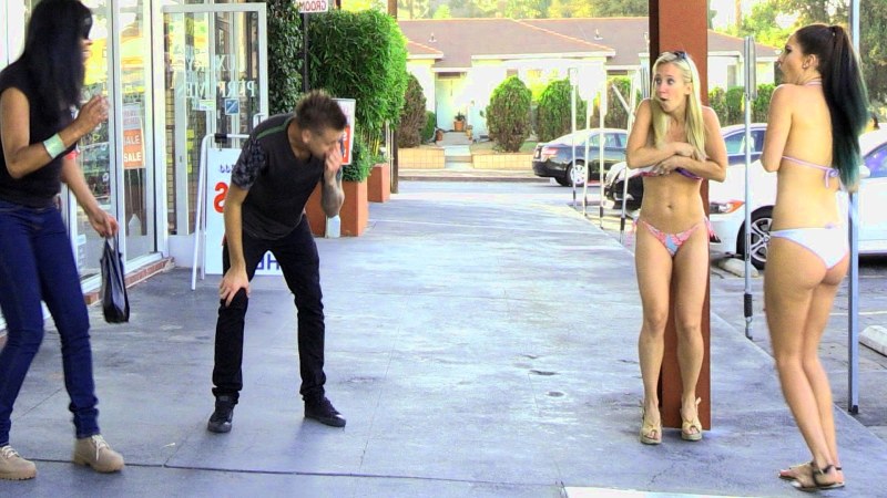 Woman undresses in public